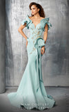 An exquisite MNM Couture 2670 mermaid gown with intricate beading, layered illusion-inset sleeves, peplum accents, and a cascading bow detail. | Couture Shop LA