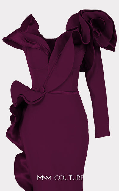 An elegant MNM Couture 2714 satin-crepe mermaid gown featuring long sleeves, ruffled details, a V-neckline, and a rosette accent for added flair. | Couture Shop LA