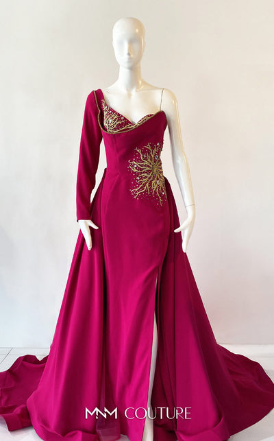 A sophisticated MNM Couture 2719 gown with a sweetheart neckline, beaded one long sleeve, high slit, detachable overskirt, and sweeping train. | Couture Shop LA