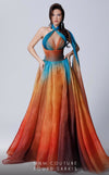 A timeless MNM Couture 2721A A-line gown with a halter neckline, cinched waistband, cutout details, and an elegant flowing cape. | Couture Shop LA