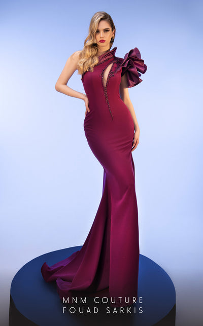 MNM Couture 2736A: Asymmetrical mermaid gown with dramatic ruffles, sparkling embellishments, and a captivating slit. | Couture Shop LA