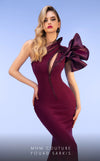MNM Couture 2736A: Asymmetrical mermaid gown with dramatic ruffles, sparkling embellishments, and a captivating slit. | Couture Shop LA