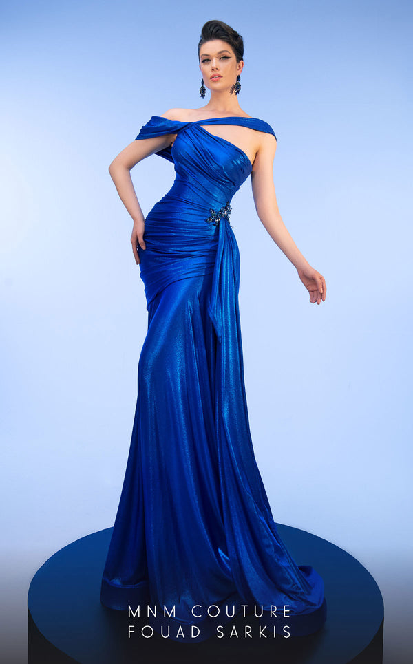 MNM Couture 2792: Asymmetrical mermaid evening gown with metallic sheen, bold embellishments, and a captivating silhouette. | Couture Shop LA.