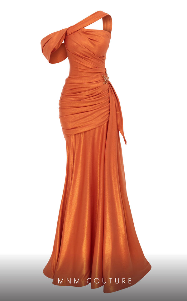 MNM Couture 2792: Asymmetrical mermaid evening gown with metallic sheen, bold embellishments, and a captivating silhouette. | Couture Shop LA.