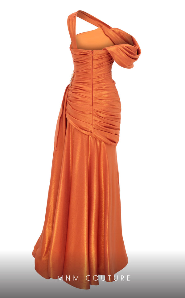 MNM Couture 2792: Asymmetrical mermaid evening gown with metallic sheen, bold embellishments, and a captivating silhouette. | Couture Shop LA.