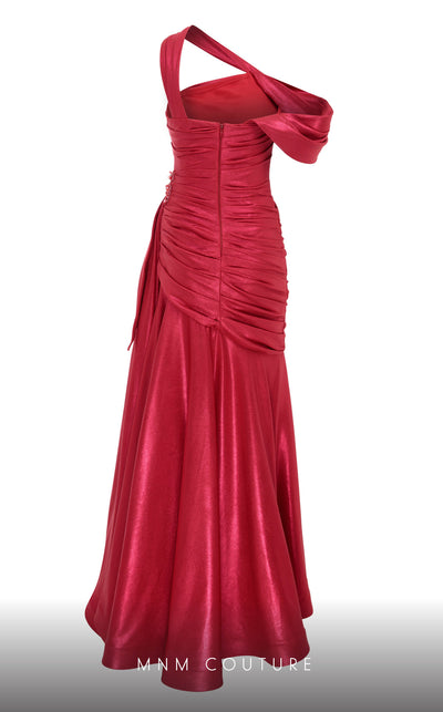 MNM Couture 2792: Asymmetrical mermaid evening gown with metallic sheen, bold embellishments, and a captivating silhouette. | Couture Shop LA.