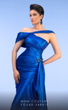 MNM Couture 2792: Asymmetrical mermaid evening gown with metallic sheen, bold embellishments, and a captivating silhouette. | Couture Shop LA.