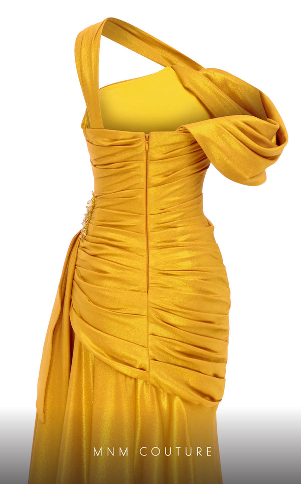 MNM Couture 2792: Asymmetrical mermaid evening gown with metallic sheen, bold embellishments, and a captivating silhouette. | Couture Shop LA.