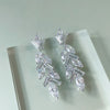 A21-E5 polished silver rhinestone earrings with sleek design| Couture Shop LA