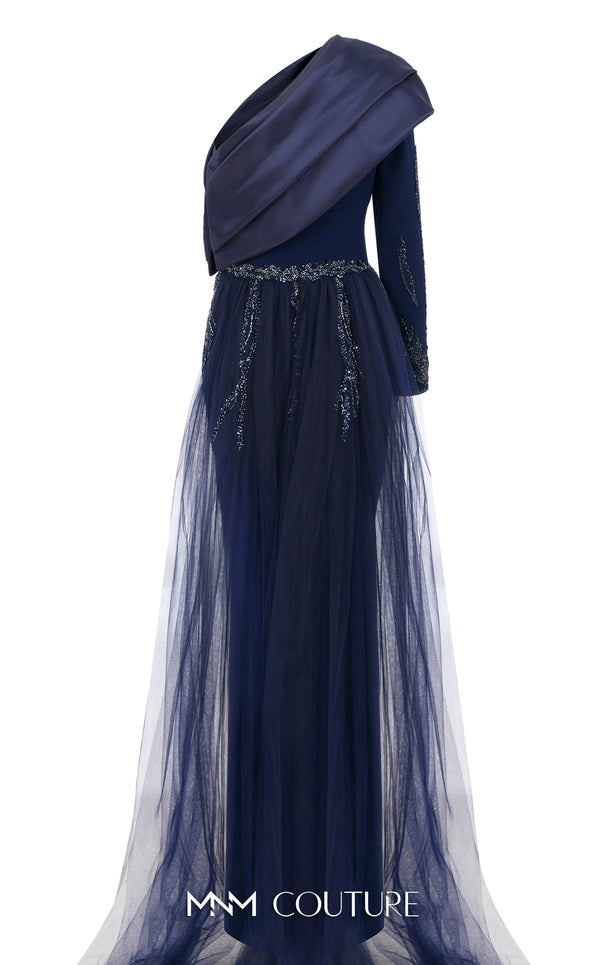 MNM Couture Style B1125 featuring a green organza gown with strap sleeves, a floral-embellished strap, cascading pleats, a V-neckline, and a flowing train.| Couture Shop LA.