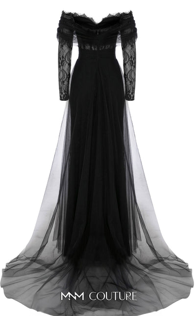 MNM Couture Style B1141 featuring a flared black organza gown with an off-the-shoulder sweetheart neckline, long sleeves, and a long, flowing train cape at the back.| Couture Shop LA.
