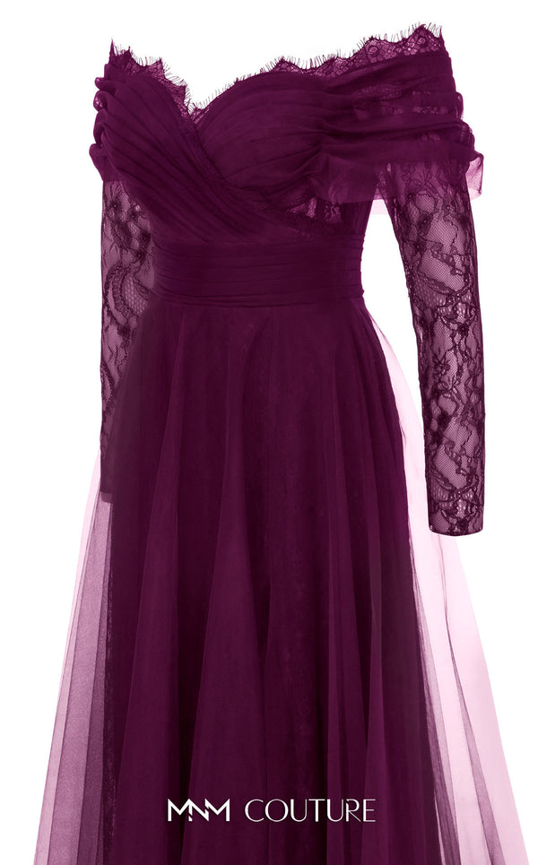 MNM Couture Style B1141 featuring a flared black organza gown with an off-the-shoulder sweetheart neckline, long sleeves, and a long, flowing train cape at the back.| Couture Shop LA.