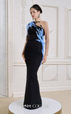 MNM Couture Style B1152 showcasing a fitted column dress in black/blue rayon crepe with an illusion neckline, long sleeves, shoulder embroidery, and a one-sided detachable train skirt. | Couture Shop LA