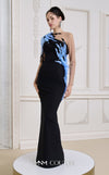 MNM Couture Style B1152 showcasing a fitted column dress in black/blue rayon crepe with an illusion neckline, long sleeves, shoulder embroidery, and a one-sided detachable train skirt. | Couture Shop LA