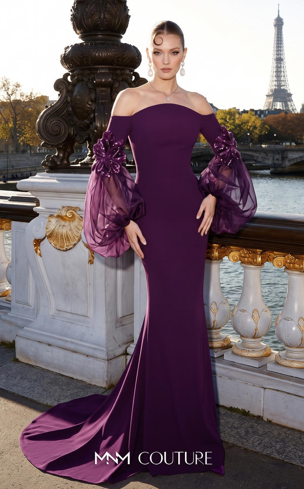 MNM Couture B1239 crepe off-shoulder mermaid gown with straight neckline, billowing sheer organza puffed sleeves, 3D sequined floral appliqués at the forearms, and small train | Couture Shop LA.
