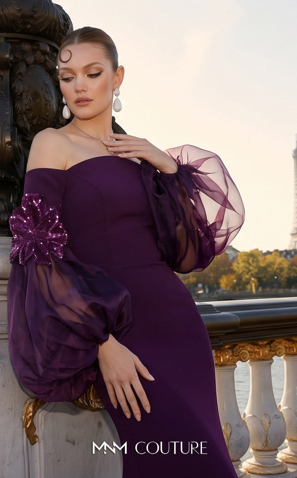 MNM Couture B1239 crepe off-shoulder mermaid gown with straight neckline, billowing sheer organza puffed sleeves, 3D sequined floral appliqués at the forearms, and small train | Couture Shop LA.