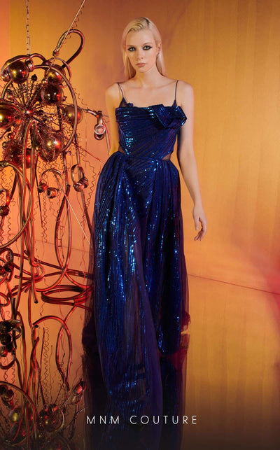 MNM Couture Style E0049 in royal blue, showcasing an A-line silhouette in embroidered mesh, an asymmetric neckline with a knot, spaghetti straps, and a dramatic back skirt. | Couture Shop LA.