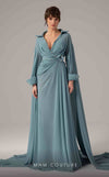 MNM Couture Style E0093 in mint green, featuring a flared silhouette, a collared V-neckline with brooch details, a belted waist, and long cape sleeves that form a train. | Couture Shop LA