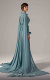 MNM Couture Style E0093 in mint green, featuring a flared silhouette, a collared V-neckline with brooch details, a belted waist, and long cape sleeves that form a train. | Couture Shop LA