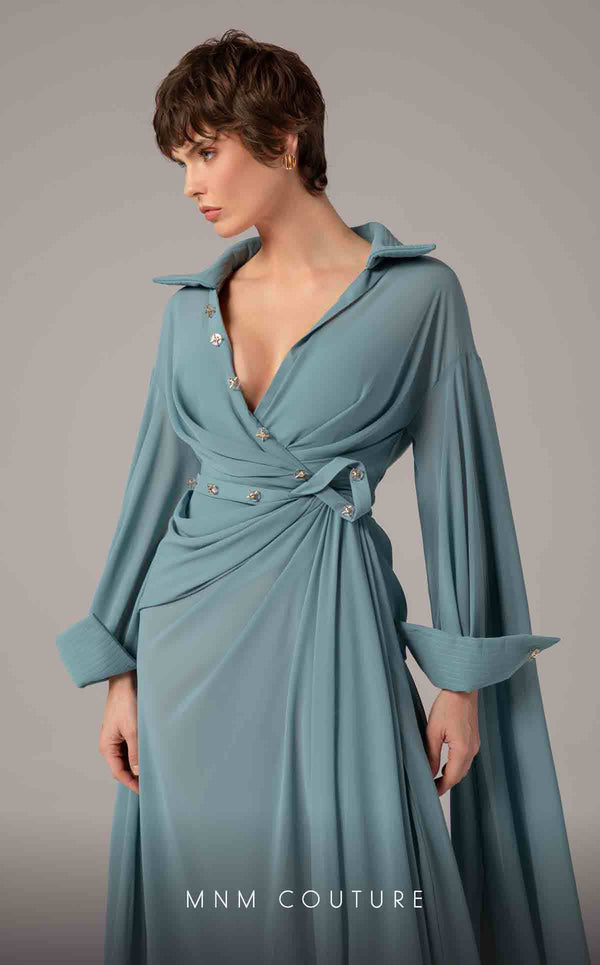 MNM Couture Style E0093 in mint green, featuring a flared silhouette, a collared V-neckline with brooch details, a belted waist, and long cape sleeves that form a train. | Couture Shop LA