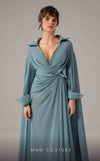 MNM Couture Style E0093 in mint green, featuring a flared silhouette, a collared V-neckline with brooch details, a belted waist, and long cape sleeves that form a train. | Couture Shop LA