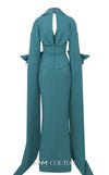 MNM Couture Style E0094 gown with cape sleeves, a collar neckline, and a striking side slit. / Couture Shop LA