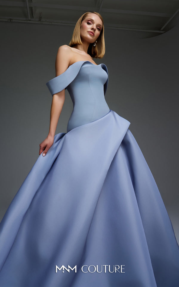 MNM Couture Style E0103 in ice blue, featuring an A-line silhouette with a pleated off-the-shoulder neckline, a fitted corset bodice, and a draped sash at the waist.| Couture Shop LA