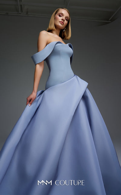 MNM Couture Style E0103 in ice blue, featuring an A-line silhouette with a pleated off-the-shoulder neckline, a fitted corset bodice, and a draped sash at the waist.| Couture Shop LA