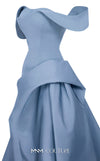 MNM Couture Style E0103 in ice blue, featuring an A-line silhouette with a pleated off-the-shoulder neckline, a fitted corset bodice, and a draped sash at the waist.| Couture Shop LA