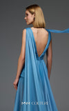 MNM Couture Style E0121 featuring a blue organza gown with a deep V-neckline, pleated corset-style bodice, an asymmetric peplum detail, and a long train. | Couture Shop LA