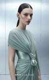 MNM Couture E0160 satin and chiffon draped column gown with asymmetric dual sleeves, satin knot waist, cape sleeve, and back fan-pleat detail | Couture Shop LA.