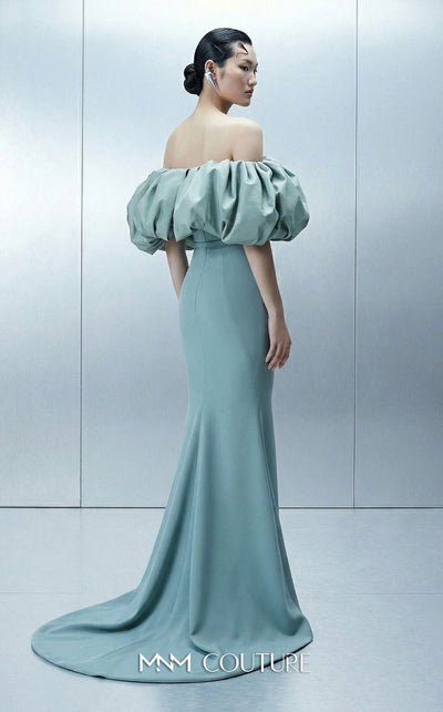 Long straight fitted crepe dress featuring an asymmetrical bodice and puffy taffeta sleeves for MNM Couture Style E0165 | Couture Shop LA.