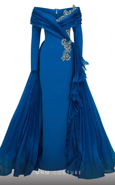 MNM Couture F02800: Off-shoulder crepe & organza gown, long sleeves, tassels, draped bust, Roman skirt, plisse tail. | Couture Shop LA