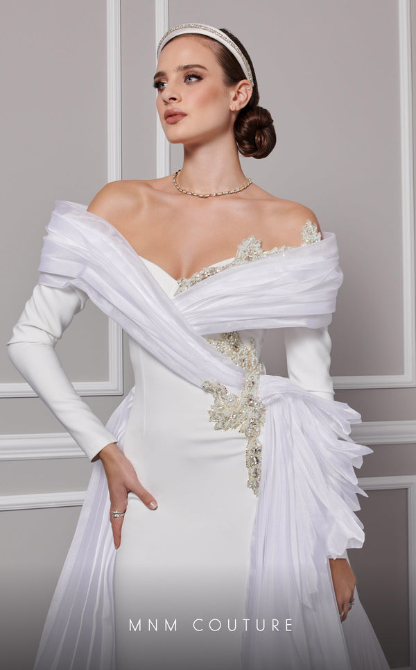 MNM Couture F02800: Off-shoulder crepe & organza gown, long sleeves, tassels, draped bust, Roman skirt, plisse tail. | Couture Shop LA
