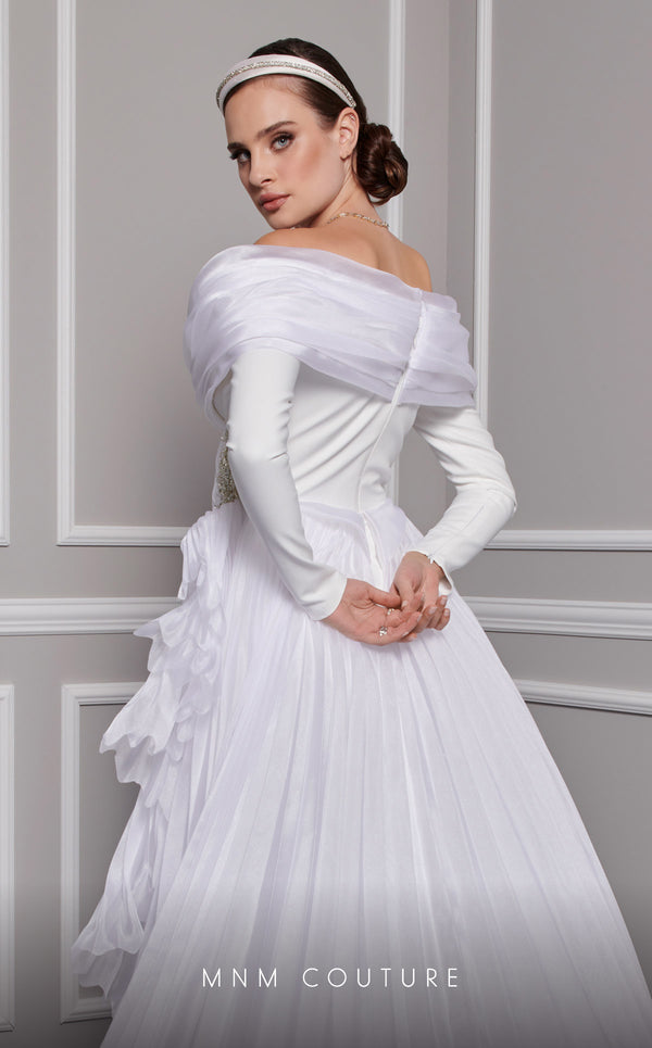MNM Couture F02800: Off-shoulder crepe & organza gown, long sleeves, tassels, draped bust, Roman skirt, plisse tail. | Couture Shop LA