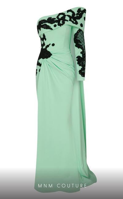 Elegant MNM Couture F02803 evening gown featuring a strapless, off-shoulder design with a single long sleeve, adorned with intricate beading and tassels | Couture Shop LA