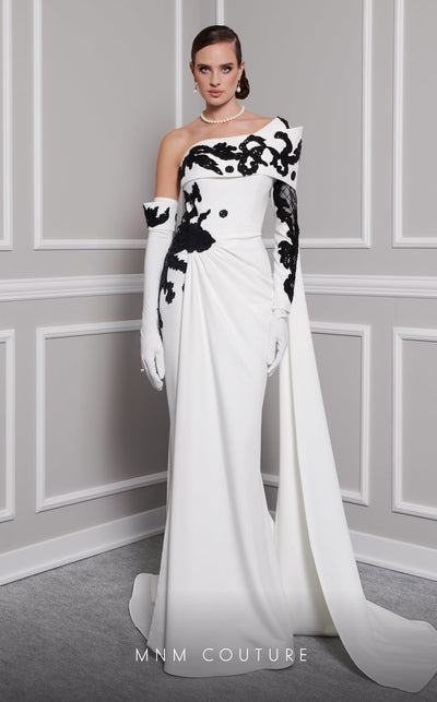 Elegant MNM Couture F02803 evening gown featuring a strapless, off-shoulder design with a single long sleeve, adorned with intricate beading and tassels | Couture Shop LA