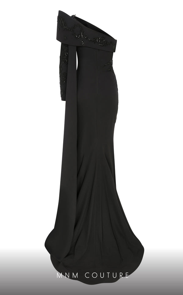 Elegant MNM Couture F02803 evening gown featuring a strapless, off-shoulder design with a single long sleeve, adorned with intricate beading and tassels | Couture Shop LA