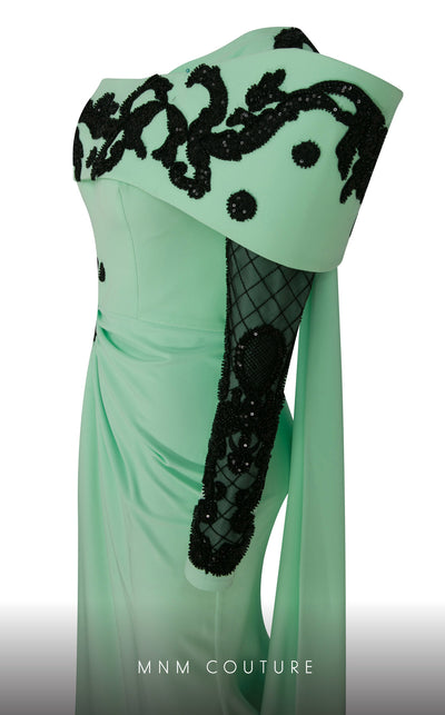 Elegant MNM Couture F02803 evening gown featuring a strapless, off-shoulder design with a single long sleeve, adorned with intricate beading and tassels | Couture Shop LA