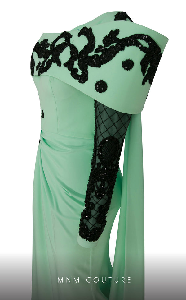 Elegant MNM Couture F02803 evening gown featuring a strapless, off-shoulder design with a single long sleeve, adorned with intricate beading and tassels | Couture Shop LA