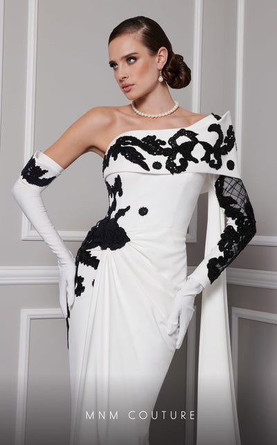 Elegant MNM Couture F02803 evening gown featuring a strapless, off-shoulder design with a single long sleeve, adorned with intricate beading and tassels | Couture Shop LA