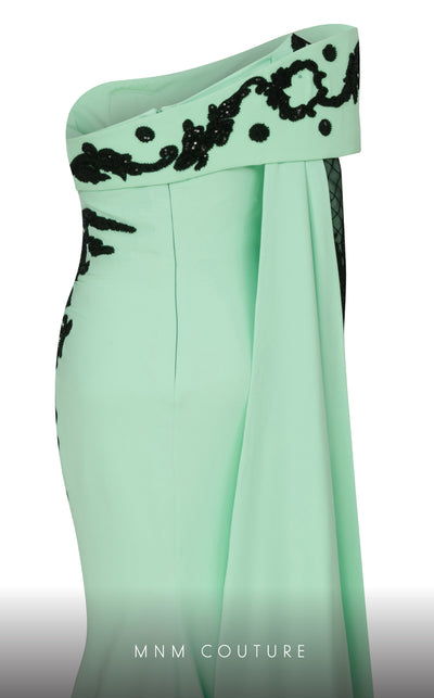 Elegant MNM Couture F02803 evening gown featuring a strapless, off-shoulder design with a single long sleeve, adorned with intricate beading and tassels | Couture Shop LA