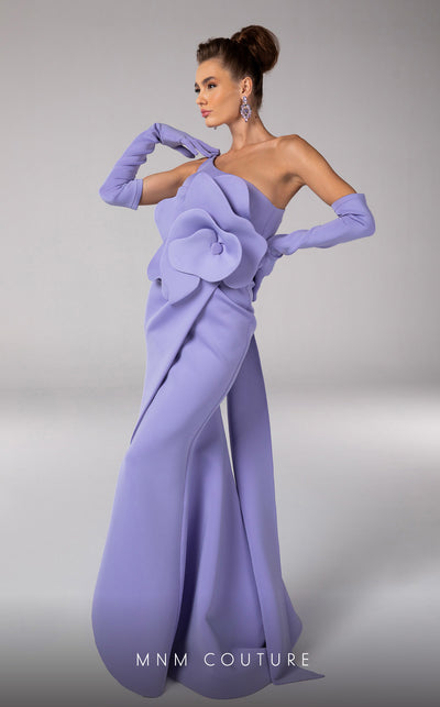 Discover the essence of evening sophistication with the MNM Couture F02826, a luxurious crepe gown embellished with a classical rose, tailored for the exclusive tastes of red carpet and special occasion aficionados. | Couture Shop LA