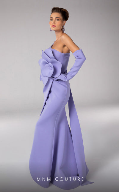 Discover the essence of evening sophistication with the MNM Couture F02826, a luxurious crepe gown embellished with a classical rose, tailored for the exclusive tastes of red carpet and special occasion aficionados. | Couture Shop LA