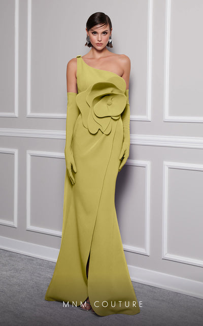 Discover the essence of evening sophistication with the MNM Couture F02826, a luxurious crepe gown embellished with a classical rose, tailored for the exclusive tastes of red carpet and special occasion aficionados. | Couture Shop LA