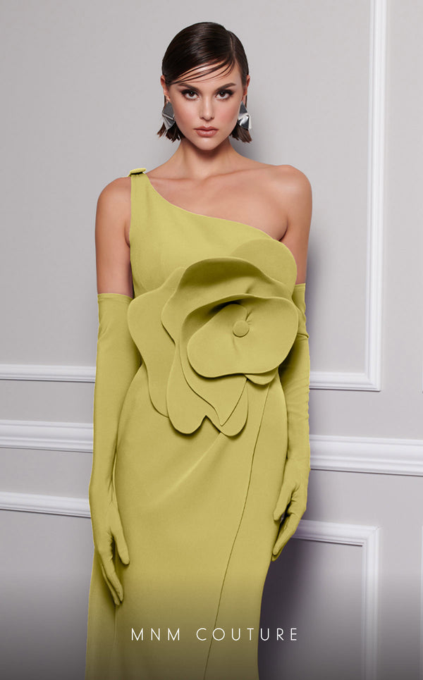 Discover the essence of evening sophistication with the MNM Couture F02826, a luxurious crepe gown embellished with a classical rose, tailored for the exclusive tastes of red carpet and special occasion aficionados. | Couture Shop LA