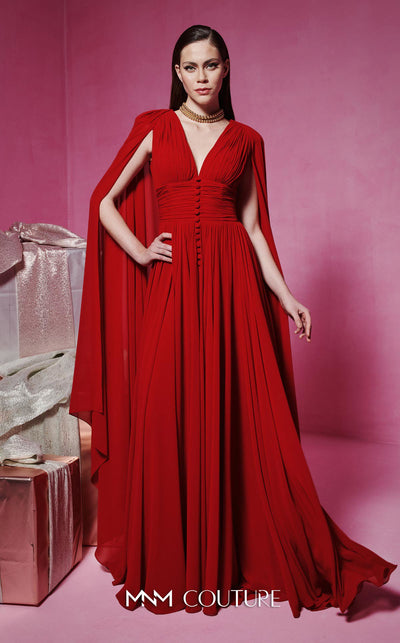 MNM Couture Style F02845 red evening dress with cape-style long sleeves, V-neckline, tailored waistline adorned with buttons, and long flowing train | Couture Shop LA.