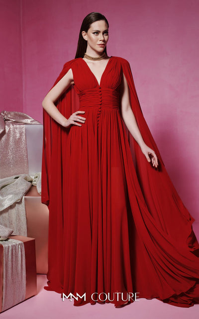 MNM Couture Style F02845 red evening dress with cape-style long sleeves, V-neckline, tailored waistline adorned with buttons, and long flowing train | Couture Shop LA.