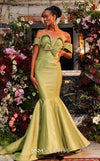 MNM Couture Style F02901 dress showcasing a pleated sweetheart neckline, mid-bow detail, and a stunning mermaid silhouette. / Couture Shop LA