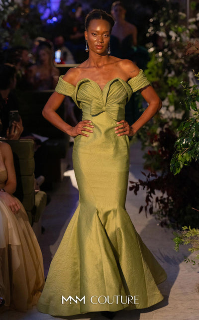 MNM Couture Style F02901 dress showcasing a pleated sweetheart neckline, mid-bow detail, and a stunning mermaid silhouette. / Couture Shop LA